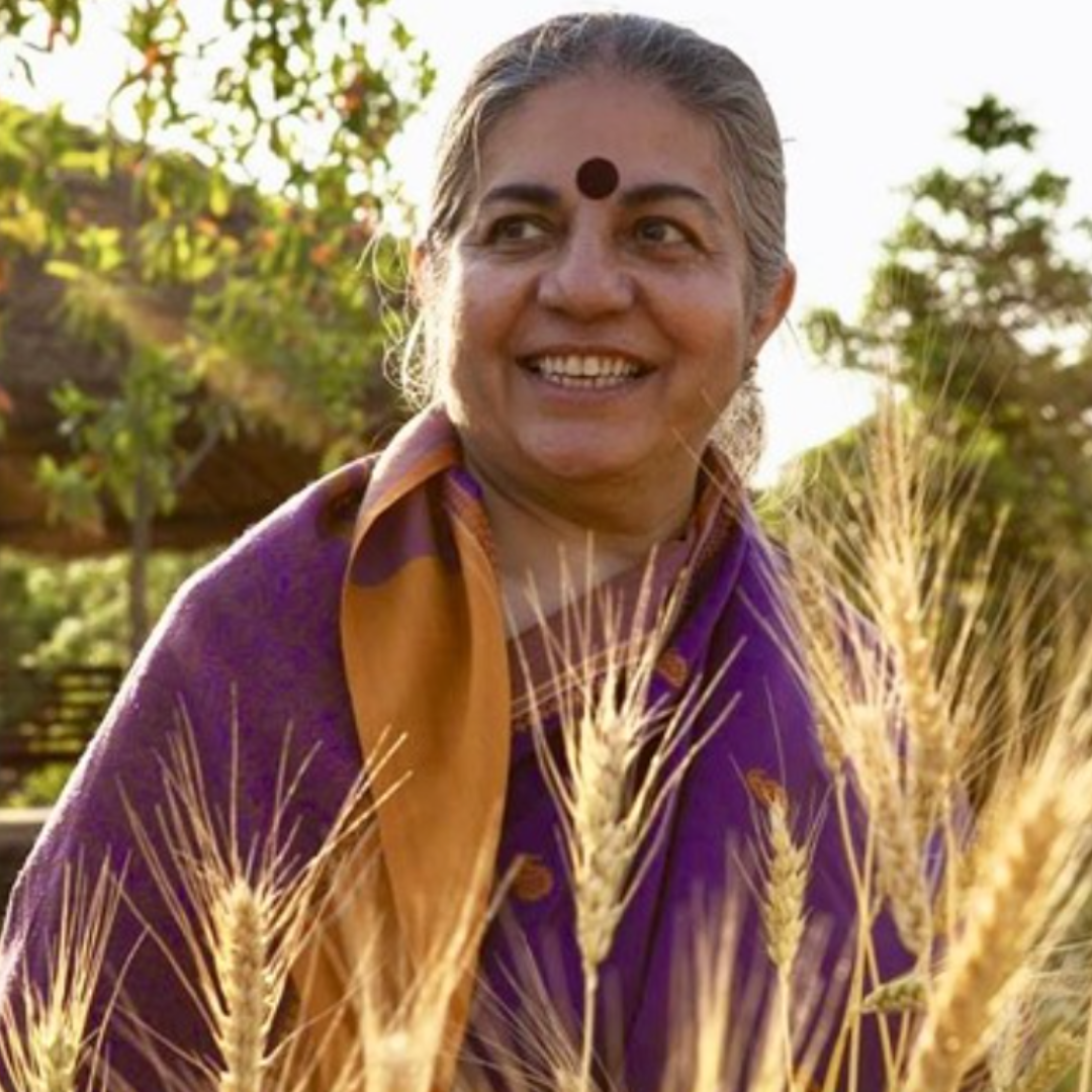 vandana shiva headshot, greenery in the background