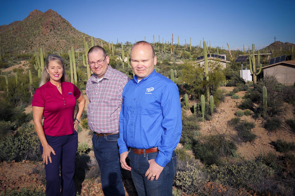 Cooper Director Colin Waite talks with TEP 's Wendy Erica Werden and Ted Burhans about improvements to the Center's solar energy system.